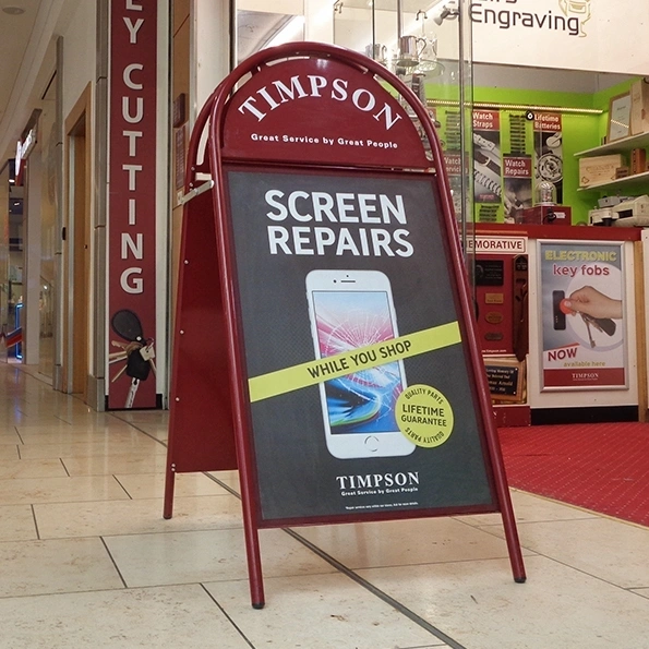 Booster In Shopping Centre Showing Timpson Screen Repair Artwork