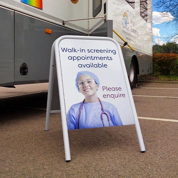  A - Board In Car Park Showing Medical Treatment Artwork